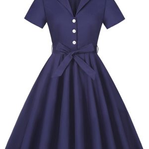 Oransje kjole med prikker i 50-tallets pin up-stil